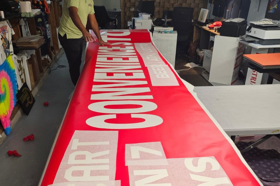 Working on the sign, Cathcart Store, London, Ontario