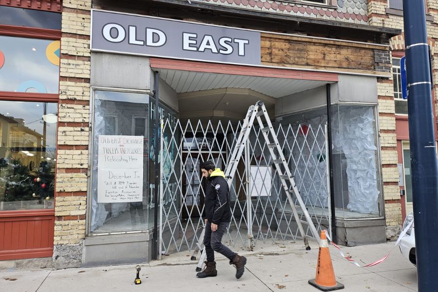 Installing signage, Old East Exchange, London, Ontario