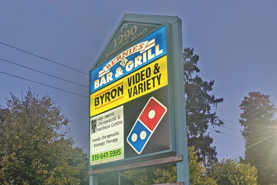 Translucent pylon sign, night time, Domino's Pizza, London, Ontario